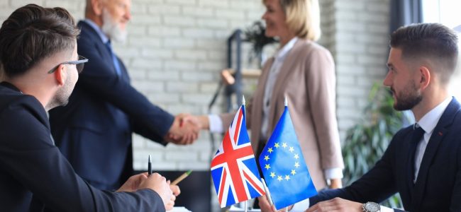 european-union-united-kingdom-leaders-shaking-hands-deal-agreement-brexit (1)