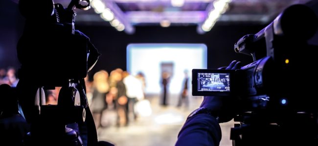man-photographing-illuminated-lamp-night (1)