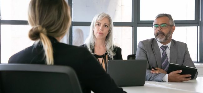 serious-employer-hr-manager-talking-job-candidate-interview-back-view-closeup-human-resource-career-concept (1)